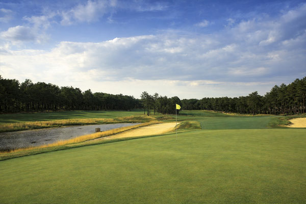 Tree lined fairway and bunker