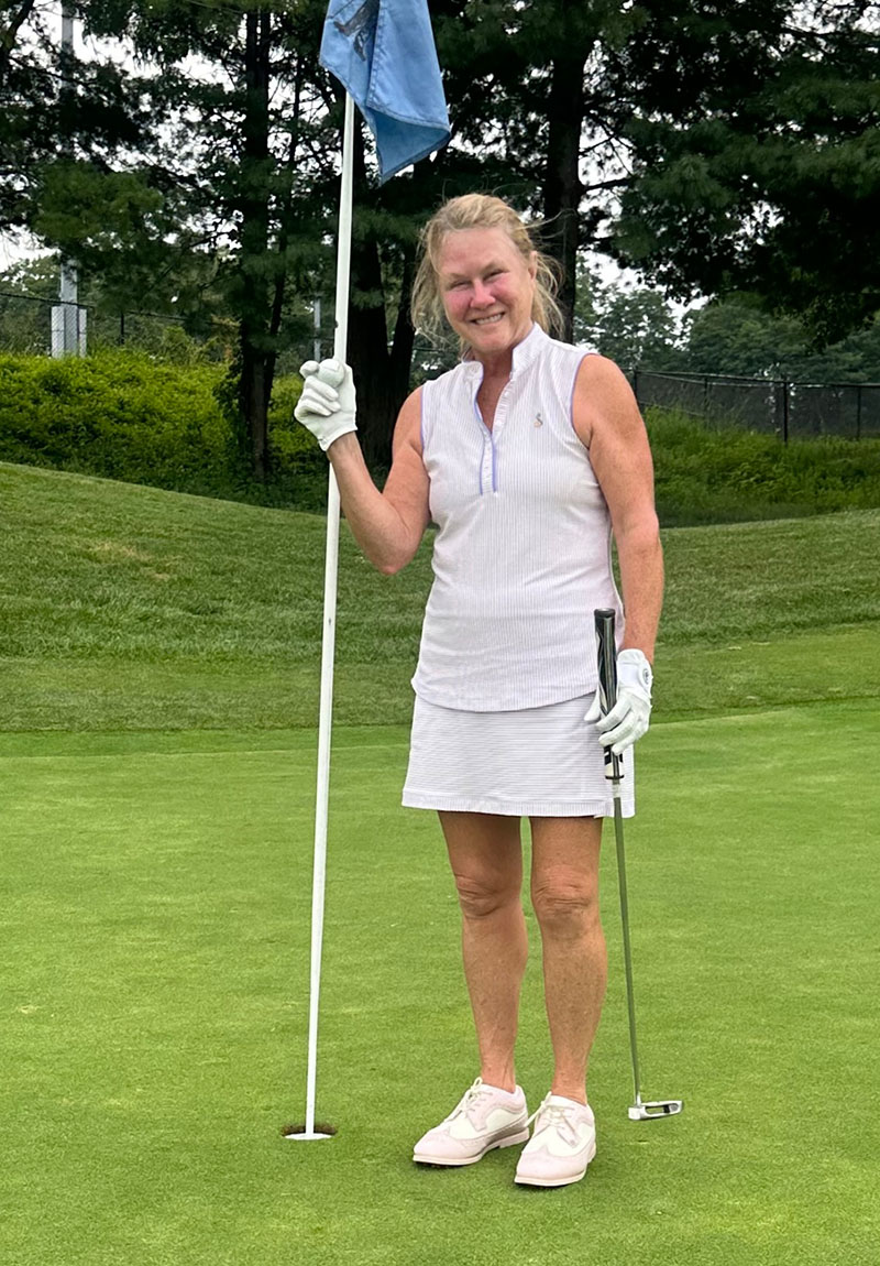 Kathleen Gallo at the 9th hole flagstick