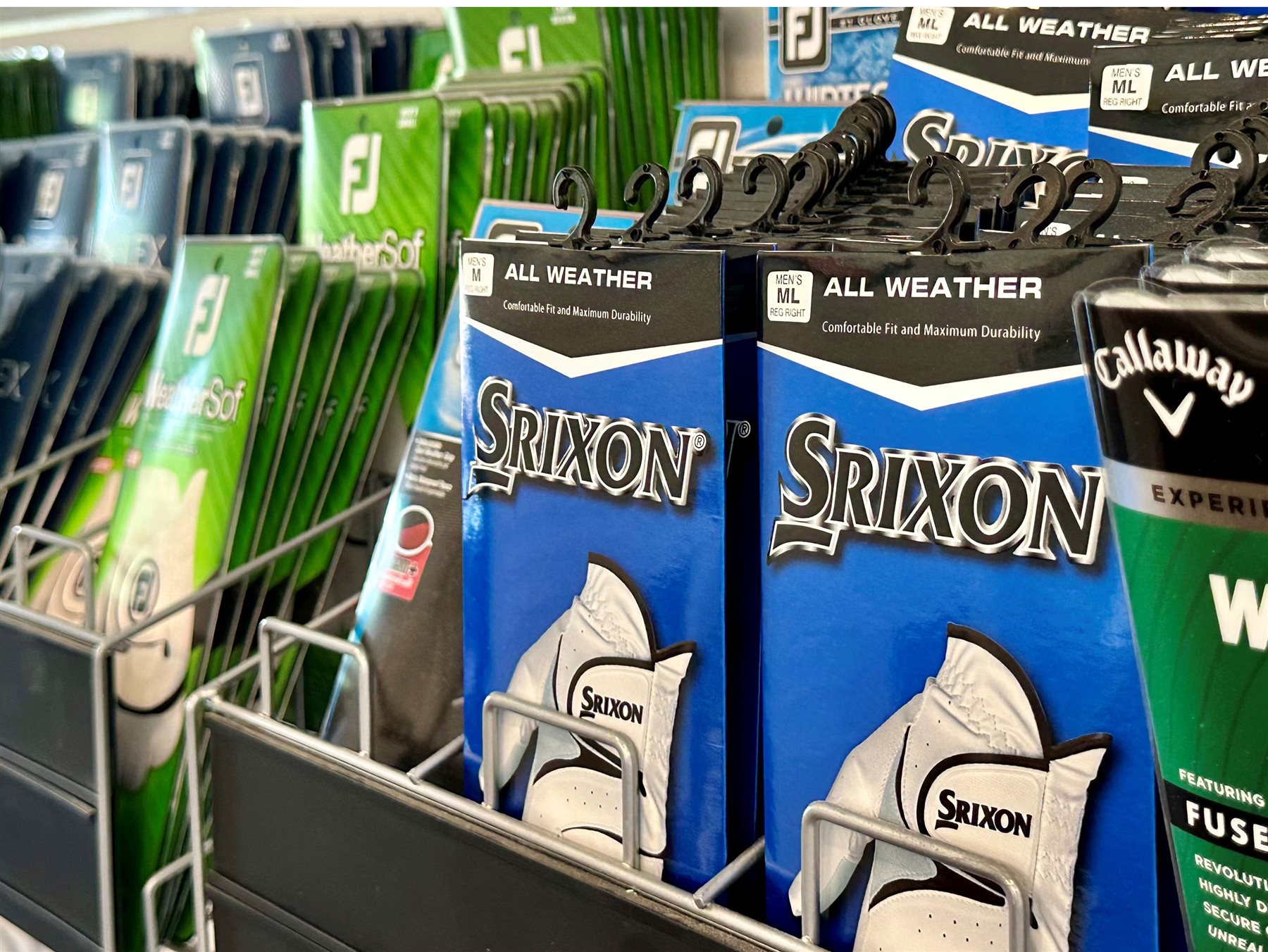 Golf gloves and accessories on a display rack
