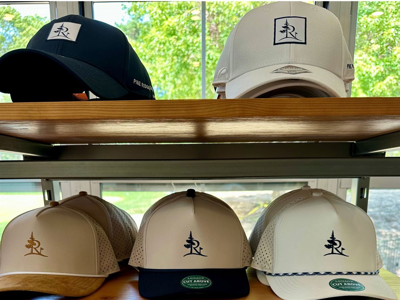 Pine Ridge branded caps on a display shelf